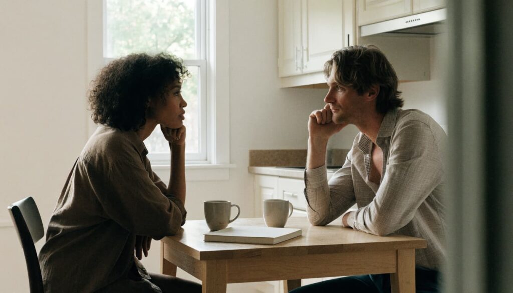 The Dynamics of Healthy Relationships: Examples and Simple Scripts 2 Two partners discuss plans at a kitchen table with a notebook and mugs.